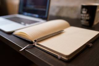 A notebook and laptop